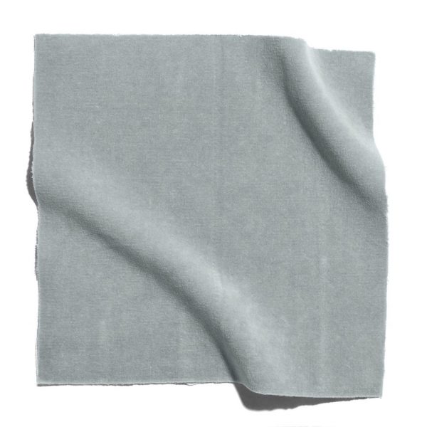 A folded piece of gray linen on a white surface. Perfect for online fabric shopping in Mumbai